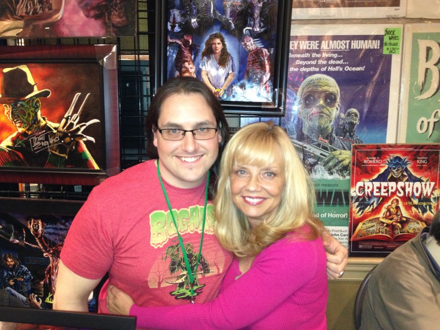 Ending things on a bright note with an adorable shot of Maroney and (best horror artist ever) Chris Kuchta, 'backgrounded' by his work.